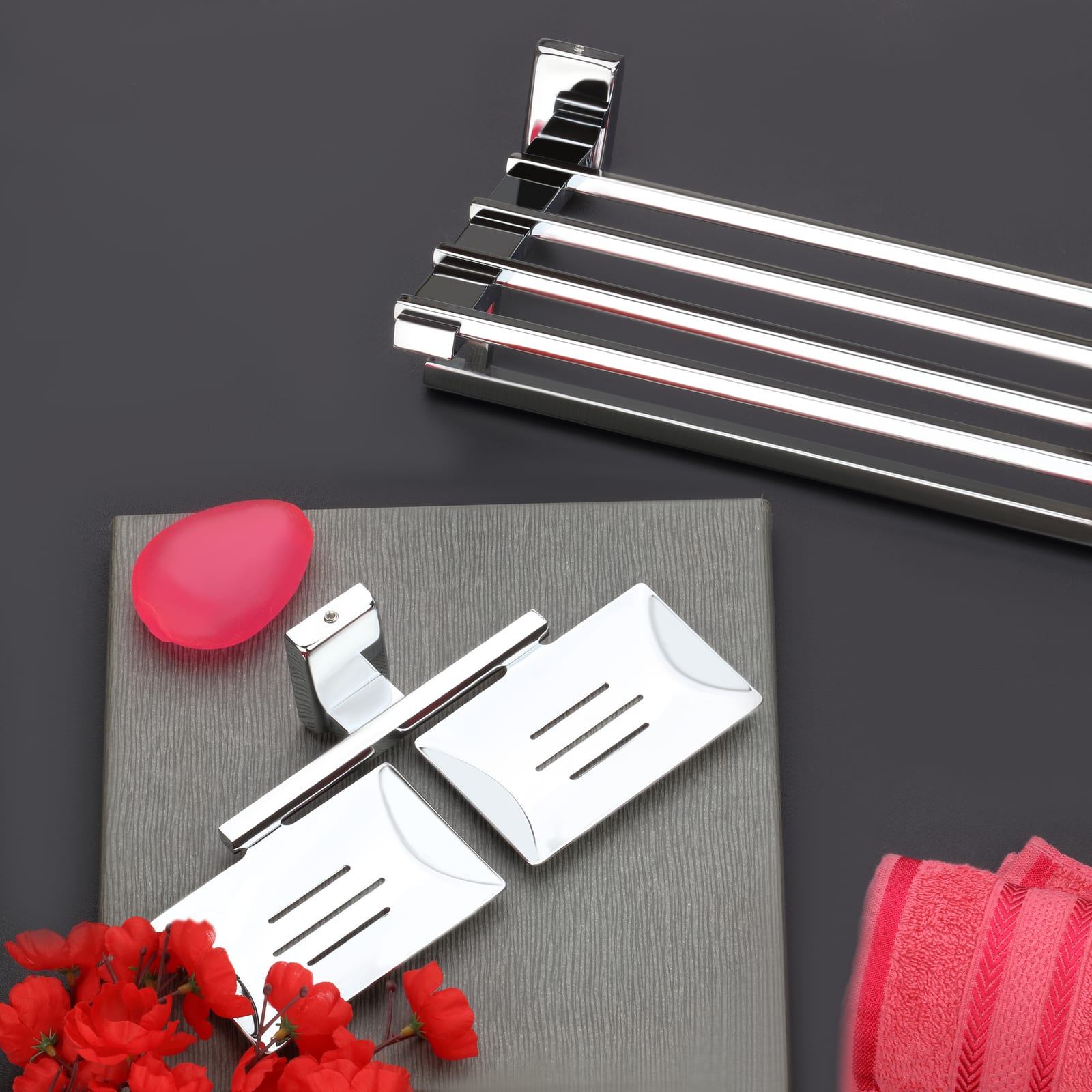 Opula series towel rail and twin soap dishes on a charcoal backdrop with red blooms